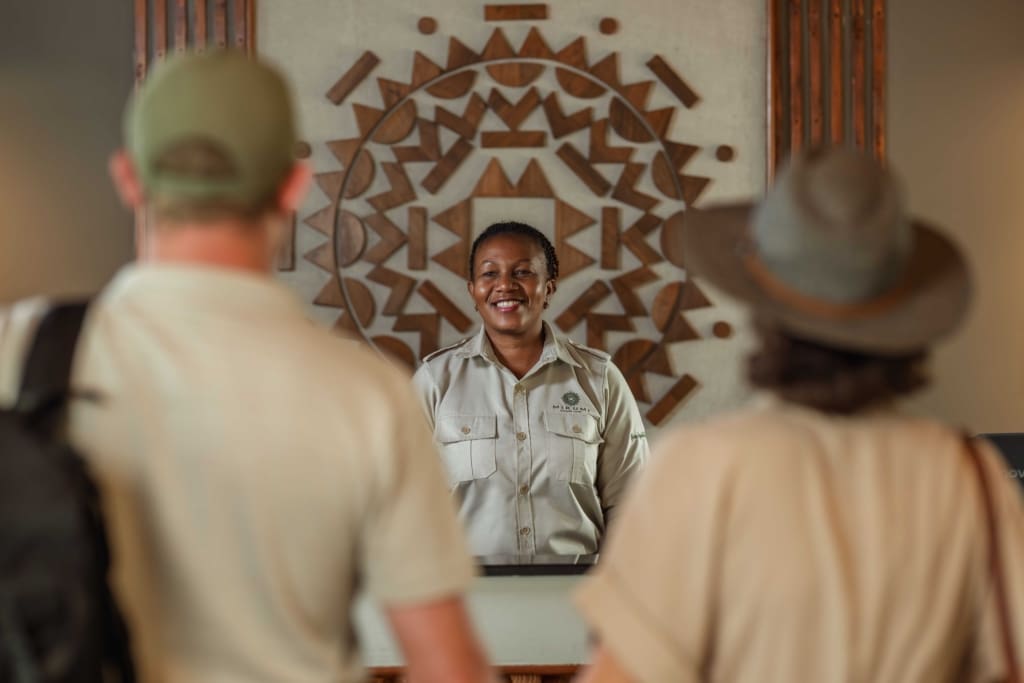 Receptionist smiling at guests